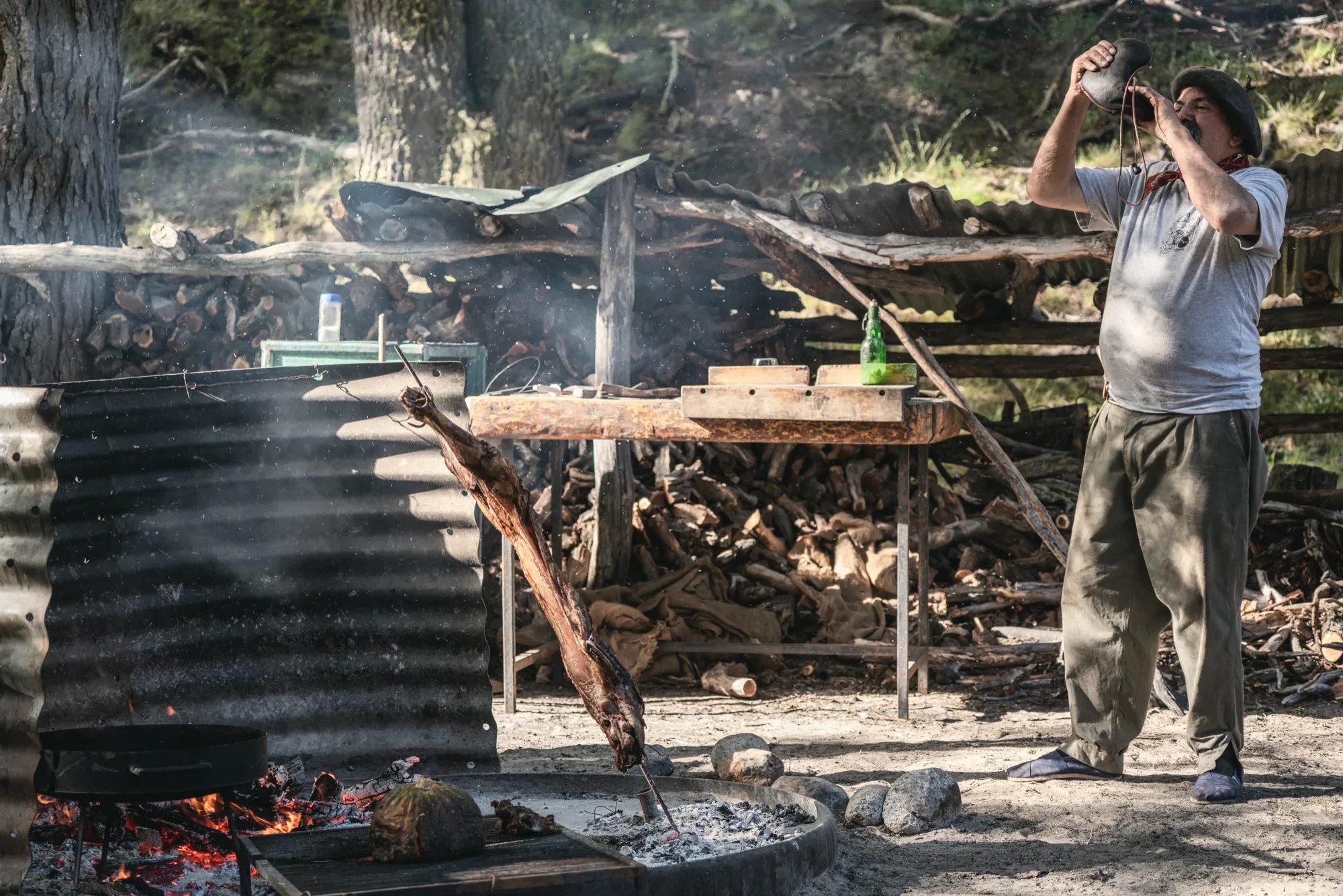 The asador checking whether it is done