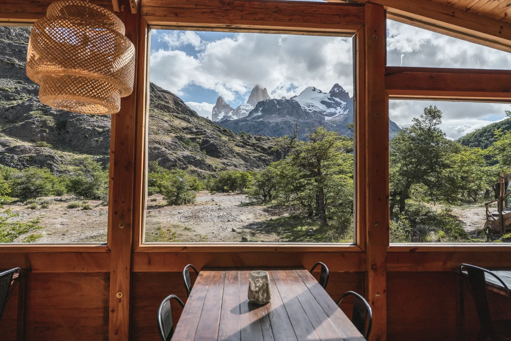 A restaurant table at the window, with Fitz Roy