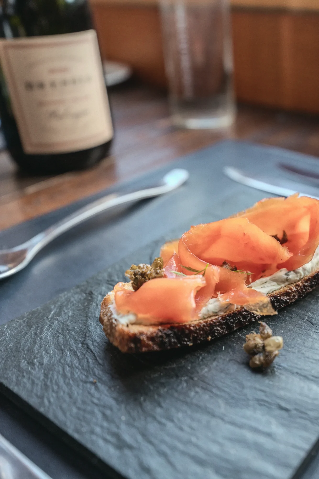 Smoked salmon toast and a bottle of red